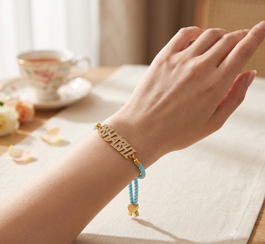 CZ Stones Bhabhi Rakhi with Blue Thread Gold Plated